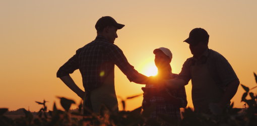 Three people join hands in cooperation